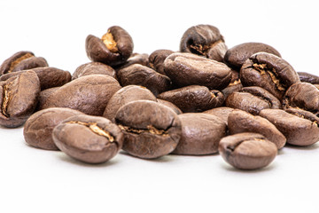 Close up of coffee beans on a white background