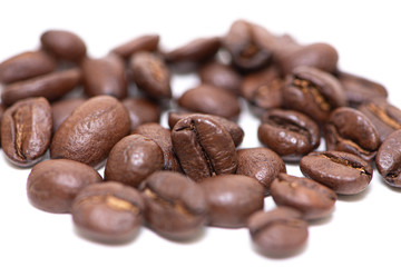 Close up of coffee beans on a white background