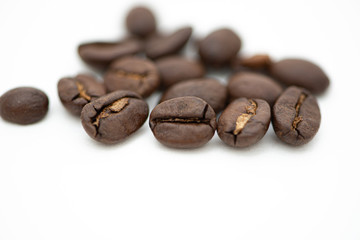 Close up of coffee beans on a white background