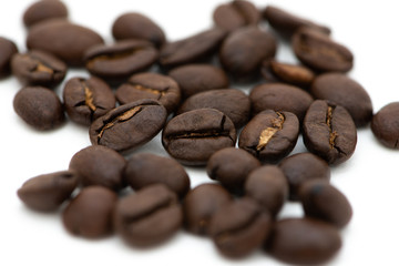 Close up of coffee beans on a white background