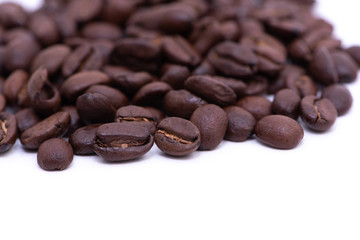 Close up of coffee beans on a white background