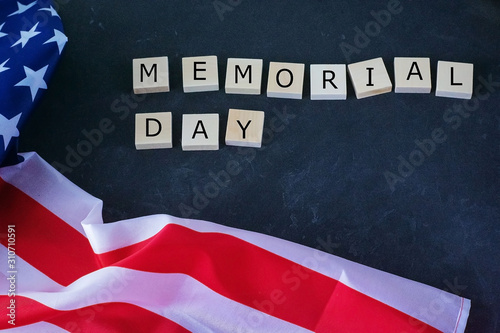 Memorial Day. American flag and the inscription on a black background