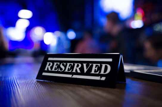 Table reservation sign close up. Ready for a party