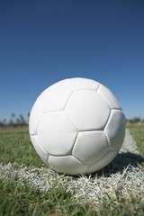 Fototapeta na wymiar Closeup of a soccer ball on corner of field