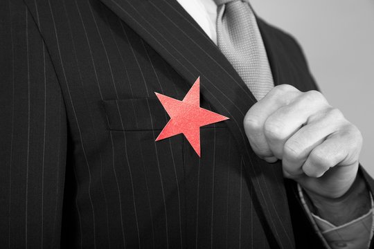 Businessman With Red Star On Suit