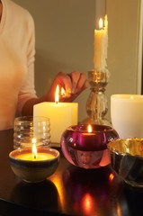 Closeup Of Woman Lighting Candles