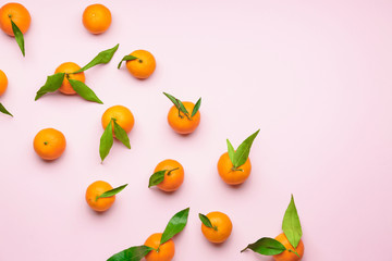 Sweet tangerines on color background