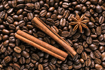 Coffee beans, anise star and cinnamon sticks, background, close-up