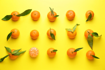 Sweet tangerines on color background
