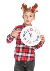 Surprised little boy with clock on white background. Christmas countdown concept