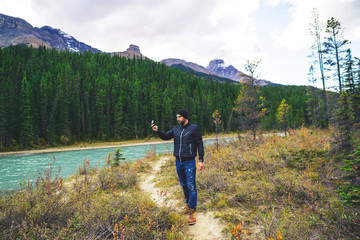 Exploring In The Outdoors Man Navigating With Compass