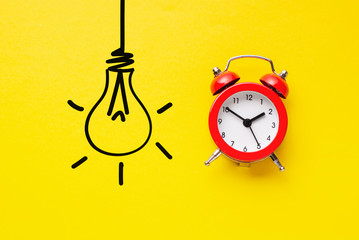 Alarm clock with hand drawn light bulb