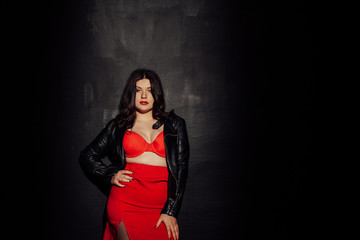 Fototapeta premium fat woman in red underwear in black room