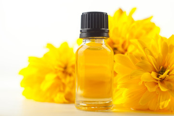 Essence of lavender flowers on White background in beautiful glass Bottle