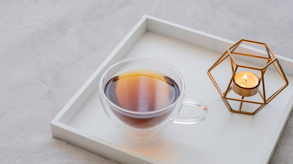 Glamorous glass tea cup with black tea