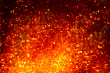 Abstract christmas background. Red fiery glare. Bokeh