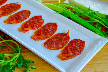 Chinese food sliced beef with tendon on a wood cutting board