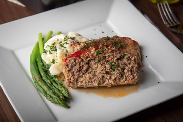 meat loaf with mashed potato and asparagus