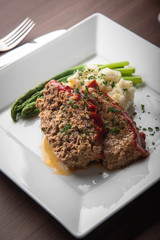 meat loaf with mashed potato and asparagus