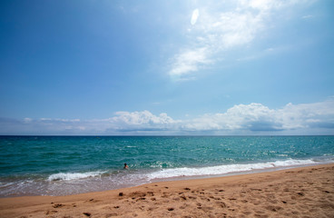 Caucasian boy playing on the beach