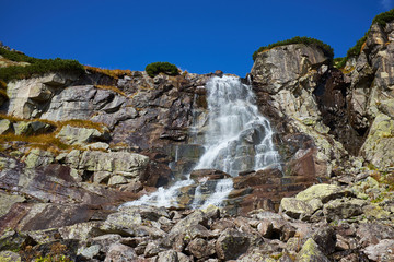 The beautiful Skok waterfall near to Strsbke Pleso in Slovakia © andras_csontos