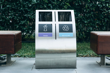 Modern waste bin for separate collection of trash and recyclable waste.