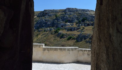 Matera is a city located on a rocky outcrop in Basilicata, in Southern Italy. It includes the area of the Sassi, a complex of Cave Houses excavated in the mountain.