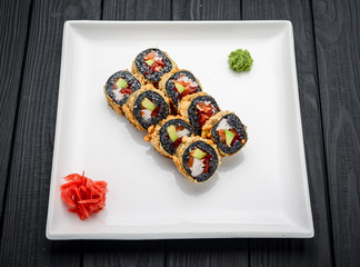 Sushi Roll made of Fresh Salmon, Avocado and Cream Cheese with black rice