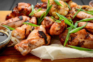 chicken wings and legs on a wooden table