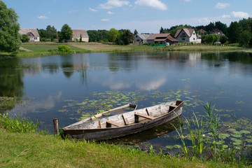 Fototapeta premium Wooden boat on a lake outside Ignalina, Lithuania