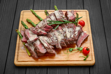 Beef sliced on wooden background