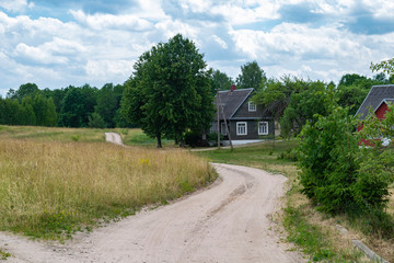 Fototapeta na wymiar House and dirt road in Aukstaitija National Park, Lithuania