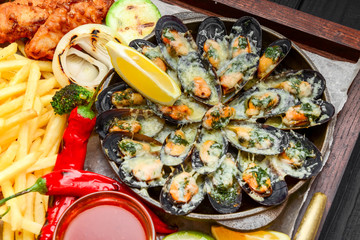 fried fish, mussels, and shrimp with potatoes