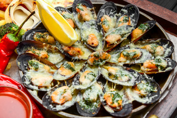fried fish, mussels, and shrimp with potatoes