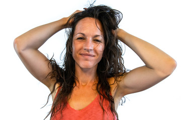  front portrait of a stunning caucasian woman with messy brunette hair and orange vest after a...