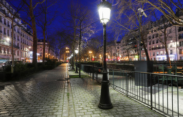 The park near Canal Saint-Martin at night .It is long canal in Paris, connecting the Canal de l'Ourcq to the river Seine.