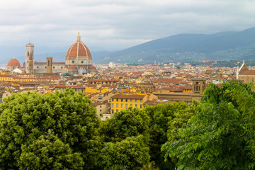 Fototapeta na wymiar Aerial view of Florence Italy, beautiful old city full of historical amazing buildings, cathedrals and bridges. 