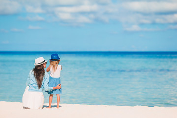 Beautiful mother and daughter on Caribbean beach