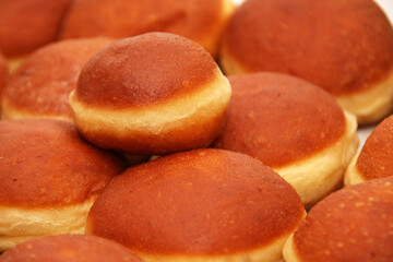 Many fresh homemade Austrian Carnival Donuts so called Austrian Faschingskrapfen or Berliner. sweet  Krapfen filled with apricot jam close up