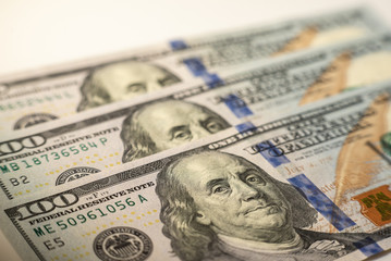 100 dollars bills close-up and portrait of Benjamin Franklin on US cash bill