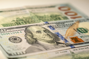100 dollars bills close-up and portrait of Benjamin Franklin on US cash bill