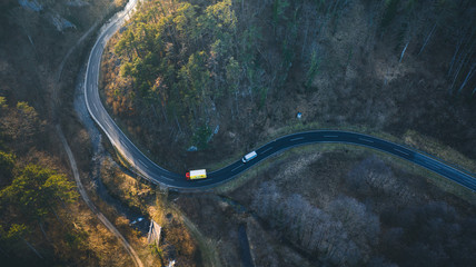 Road in the autumn forest aerial view
