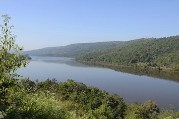 Fototapeta na wymiar Landscape with mountains and calm lake, India