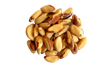 Many delicious Brazilian nuts isolated on white background. Healthy snack and food. Top view. Heap of brazil nuts.