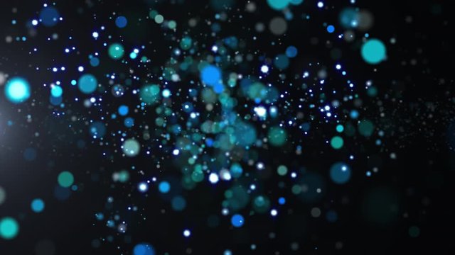 Blue glitter texture sparkles flying on dark background. 4k glittering footage. Abstract animation backdrop.