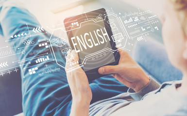 English concept with man using a tablet in a chair