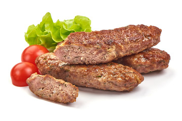 Fried cevapcici, balkan sausages, isolated on white background