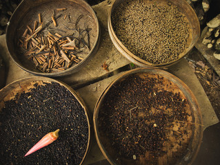 Spices drying in a straw bowls