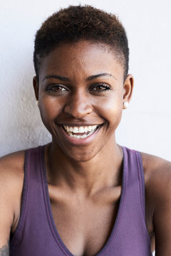 Laughing black afro fitness woman.
