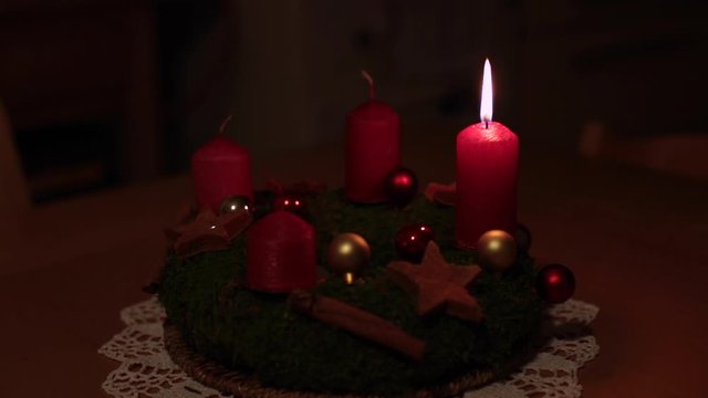 Mother making an advent wreath with child, christmas spirit